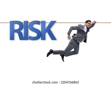 Businessman In Risk Concept Walking On Tight Rope