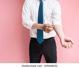 Businessman Rolling Up His Sleeve