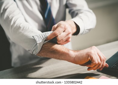 Businessman rolling up his sleeves, concept of motivation