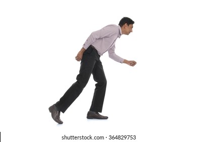 An businessman running away isolated on white background