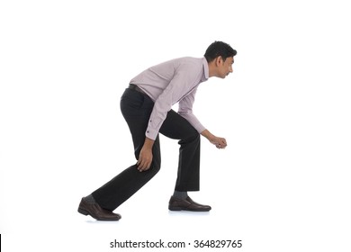 An businessman running away isolated on white background