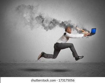 Businessman running with blue screen computer error