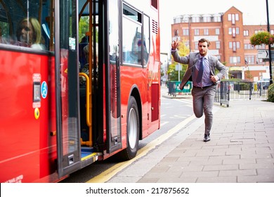Businessman Running To Catch Bus Stop
