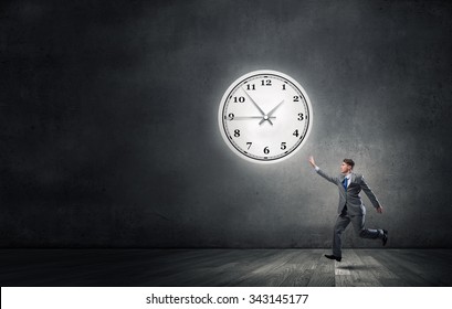 Young Businessman Trying Turn Back Time Stock Photo 331501541 