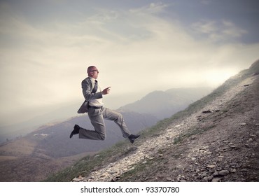 Businessman Running Uphill