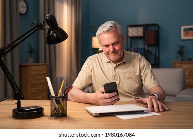 A Businessman Runs Errands On The Phone Works On The Phone Makes A Wire Transfer. A Senior Citizen Dials A Mobile Number On His Cell Phone. The Elderly Man Uses His Cell Works.