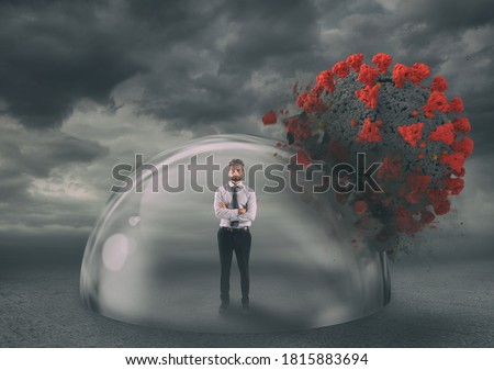 Businessman safely inside a shield dome during coronavirus pandemic. Protection and safety concept