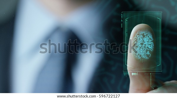 businessman scan fingerprint biometric identity\
and approval. concept of the future of security and password\
control through fingerprints in an immersive technology future and\
cybernetic,\
business