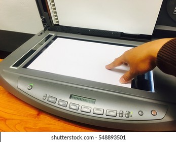 Businessman Scanning Document Paper For Copy File In Scanner To Computer.