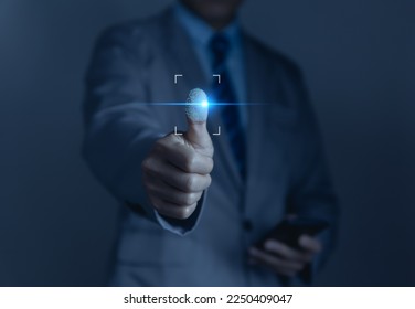 Businessman scans fingerprints for identity verification Biometrics. cybersecurity concept, computer electronic password to access privacy and business information. digital technology networking