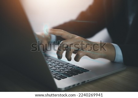 Businessman scans fingerprints for identity verification Biometrics. cybersecurity concept, computer electronic password to access privacy and business information. digital technology networking