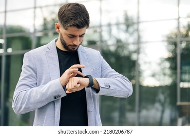 Businessman Scrolling On Display On Smartwatch Notification. Bearded Man Using Smart Watch Wearable Wristband Device. Male Checking Pulse Smartwatch App. Touch Screen Wearable Technology Smart Band.