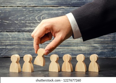 Businessman In Search Of New Employees And Specialists. The Concept Of Personnel Selection And Management Within The Team. Dismissal And Hiring People To Work. Human Resource. Selective Focus