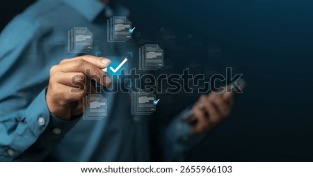 Businessman selecting digital document approval to approve business project proposal, quality assurance and assessment. Document management and network concept. Documents in online repository.