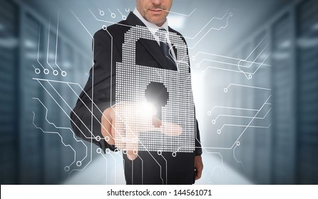 Businessman selecting a futuristic padlock with a data center on the background