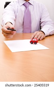 businessman selling a new car at his office (selective focus)