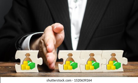 A businessman separates part of the money from the total. Payment of taxes and deductions. Corruption Kickback on orders, bribery. Financial management and distribution of funds. Saving and investing. - Shutterstock ID 1520639264