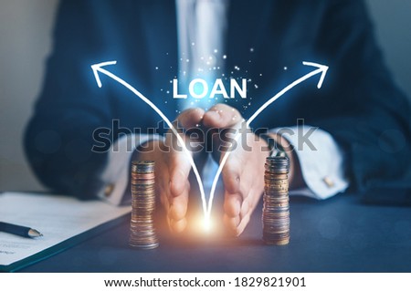 Businessman separates stack coins. 
International creditor legal services.International loan transaction  and Division concept.