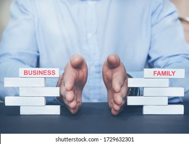 Businessman Separating Wooden Blocks With The Inscription Business And Family.
Choice Between Business And Family.
Property Division. Divorce And Legal Services.