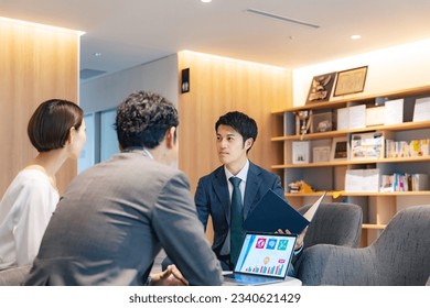 Businessman serving customers in the lobby. - Powered by Shutterstock