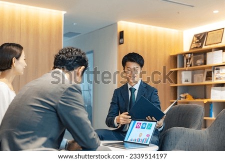 Businessman serving customers in the lobby.