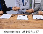 Businessman shaking hands after signing business cooperation and legal agreement contract.