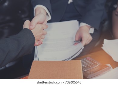 Businessman shaking hands during a meeting in the office for cooperation and partner concept. - Shutterstock ID 732605545