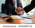 Businessman shaking hands to seal a deal with his partner
lawyers or attorneys discussing a contract agreement.Legal law, advice, and justice concept.