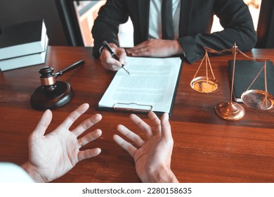 Businessman shaking hands to seal a deal Judges male lawyers Consultation legal services Consulting in regard to the various contracts to plan the case in court. - Shutterstock ID 2280158635