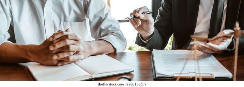 Businessman shaking hands to seal a deal Judges male lawyers Consultation legal services Consulting in regard to the various contracts to plan the case in court. - Shutterstock ID 2280158659