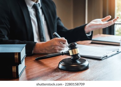 Businessman shaking hands to seal a deal Judges male lawyers Consultation legal services Consulting in regard to the various contracts to plan the case in court. - Shutterstock ID 2280158709