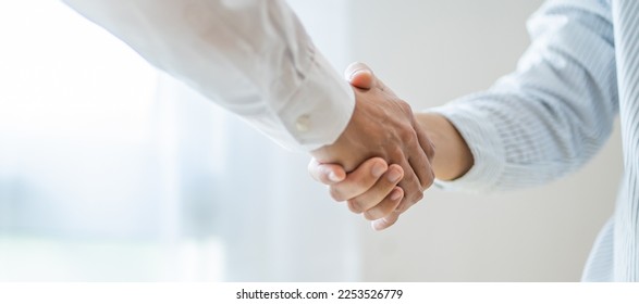 Businessman shaking hands successful making a deal. mans handshake. Business partnership Real estate meeting home purchase agreement concept