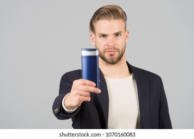 Businessman With Shampoo Or Gel Bottle In Hand. Bearded Man With Stylish Hair Or Haircut. Cosmetic For Spa Bath Or Shower. Hair Care And Beard Grooming. Mens Beauty And Health.