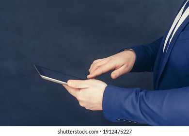 Businessman in a shirt and a blue jacket with Tablet in hand