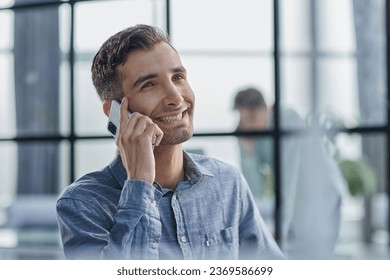 Businessman shopping over the phone in an office