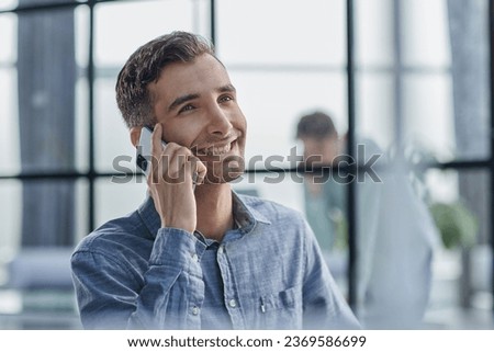 Businessman shopping over the phone in an office