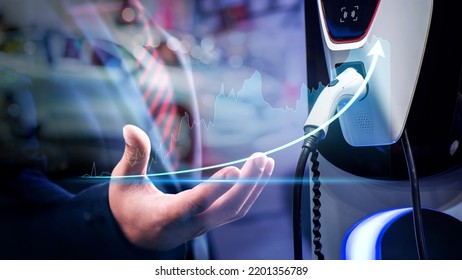 Businessman show business growth investment stock finance profit graph of marketing financial increase trade chart. Charging an electric car battery, new innovative technology EV Electrical vehicle. - Shutterstock ID 2201356789