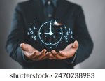 Businessman show virtual icon of clock and money for business time management. Work planning increases efficiency and reduces work time. Time is money concept.
