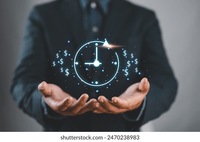 Businessman show virtual icon of clock and money for business time management. Work planning increases efficiency and reduces work time. Time is money concept. - Powered by Shutterstock