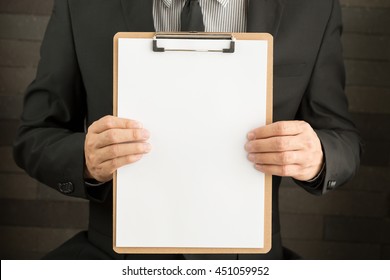 Businessman Showing Blank Document