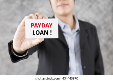 businessman showing business card with word payday loan
