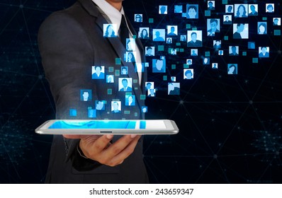 Businessman Showing Glow User Icon Floating From Tablet Screen