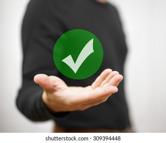 Businessman Showing Green Check Mark. Concept Of Correct Decision