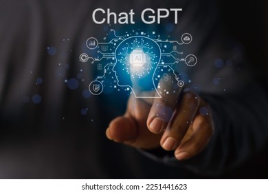 Businessman showing a hologram technology icon Chat GPT a smart AI or artificial intelligence chatbot . - Shutterstock ID 2251441623