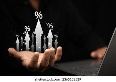 Businessman showing percentage icons and up arrow icons with graph indicators. Concept of financial interest rates and mortgage rates. Interest Rates Stocks Finance Ratings Mortgage Rates. - Shutterstock ID 2365158539