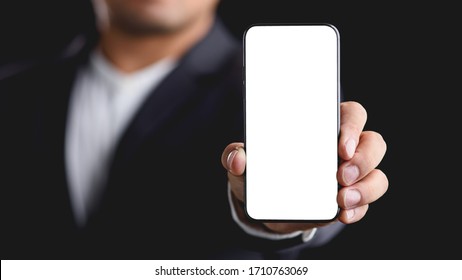businessman showing smart phone with blank screen.