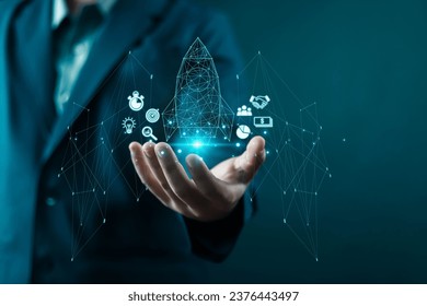 businessman showing Startup business concept Network connection icons on modern virtual interface rocket, idea, growth, digital, technology, concept, unicorn, company, future, success, global,  
					