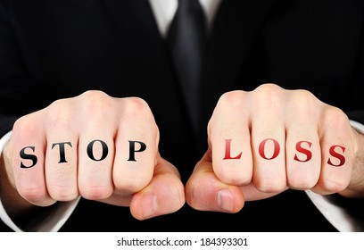 Businessman Showing Stop Loss Text On Fist