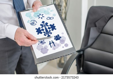 Businessman showing strategic alliance concept on a clipboard