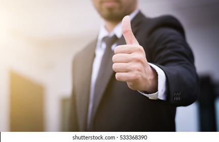 Businessman showing thumbs up - closeup shot - Shutterstock ID 533368390
